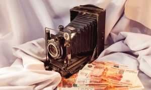 retro photo camera and money in the Studio
