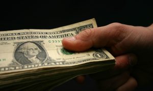 holding-money-1315930-660x395
